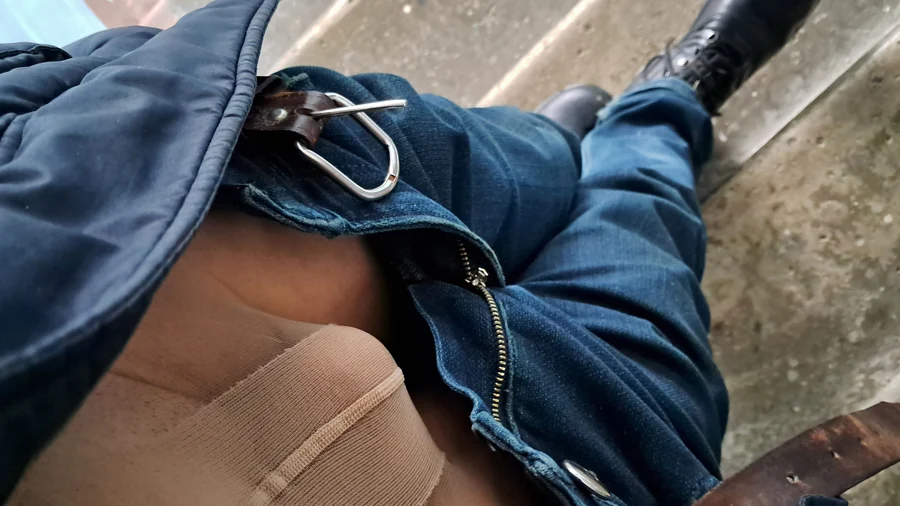 Image gallery: Man posing in women's pantyhose under jeans outdoor