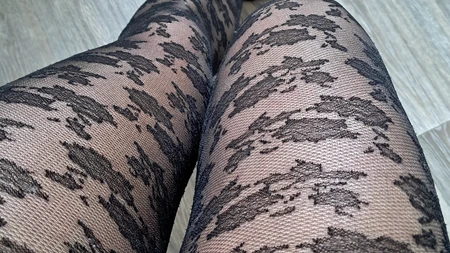 Man teases with his legs in sexy black tights